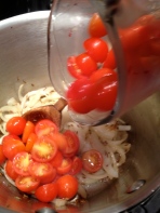 Adding all the tomatoes