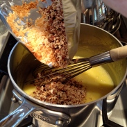 Adding toasted coconut and pecans to the custard sauce