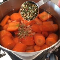 Adding herbs to the pot